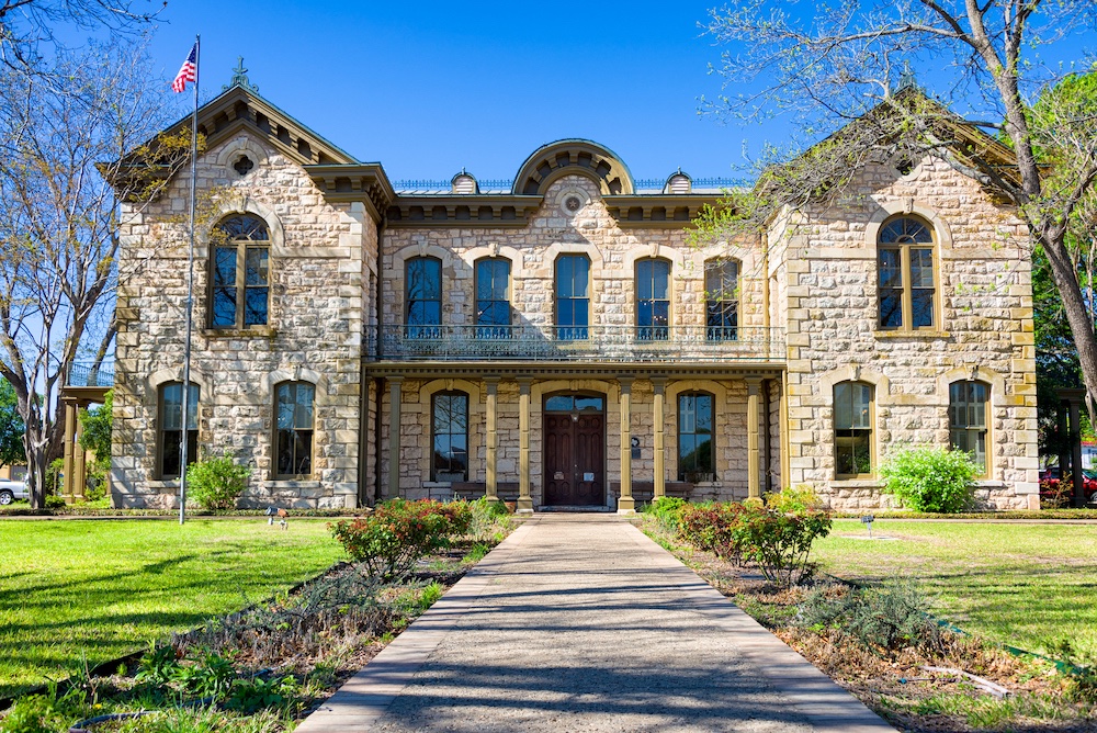 Front view of the Fredericksburg Texas public library located in Gillespie County, Central TX
